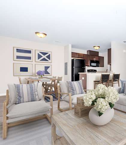 A living room with a couch, chairs, and a coffee table.